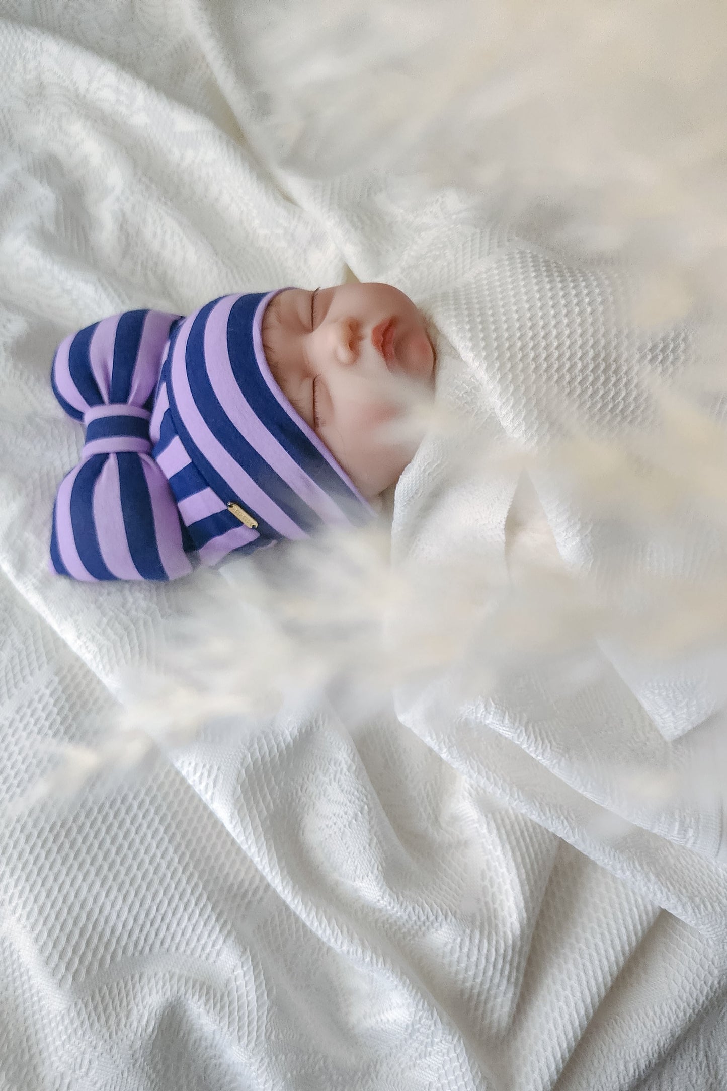 beanie bow stripe lilac and navy side view