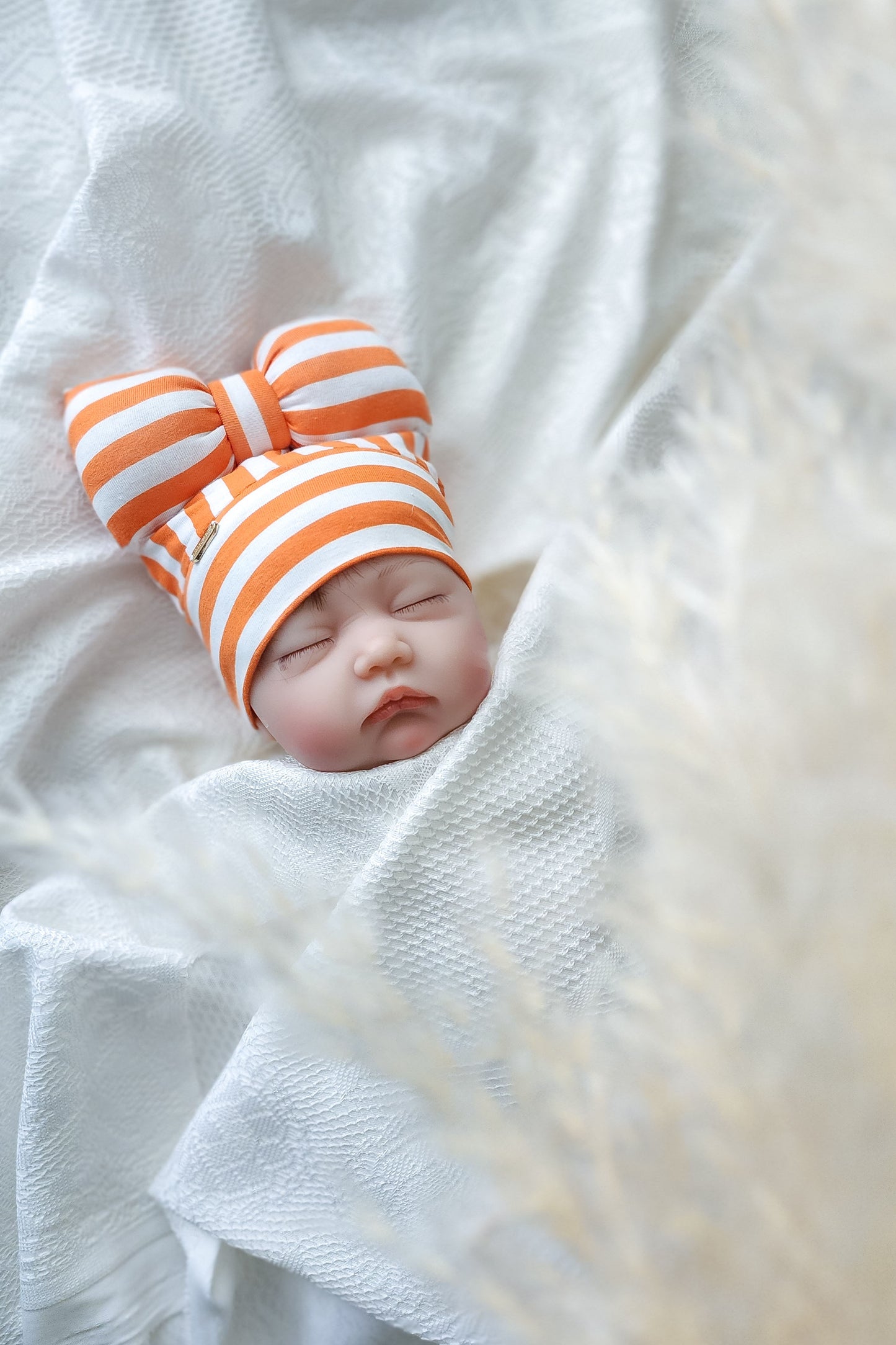 Beanie bow for baby girl or toddler, front view