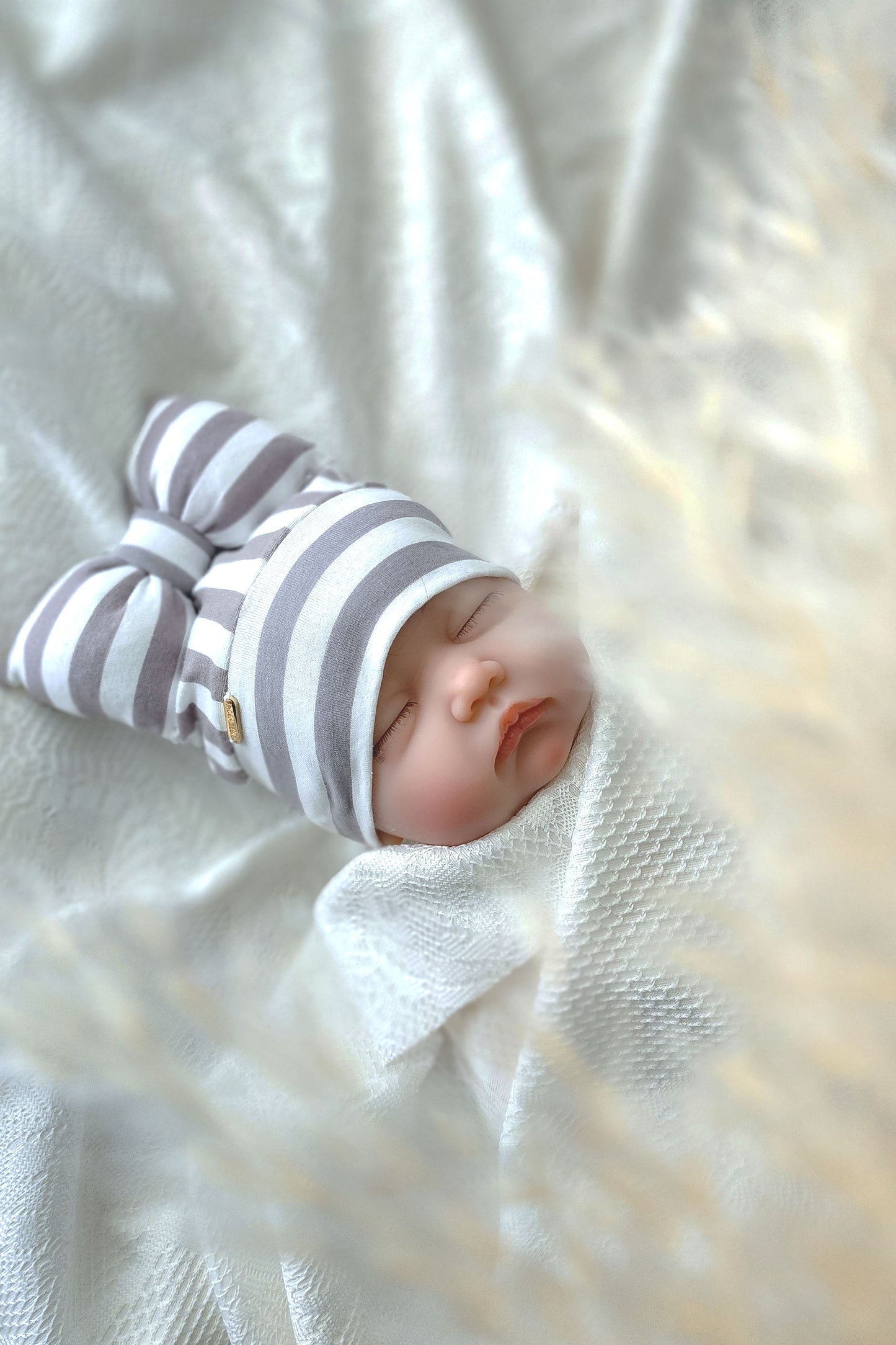 newborn beanie bow side view