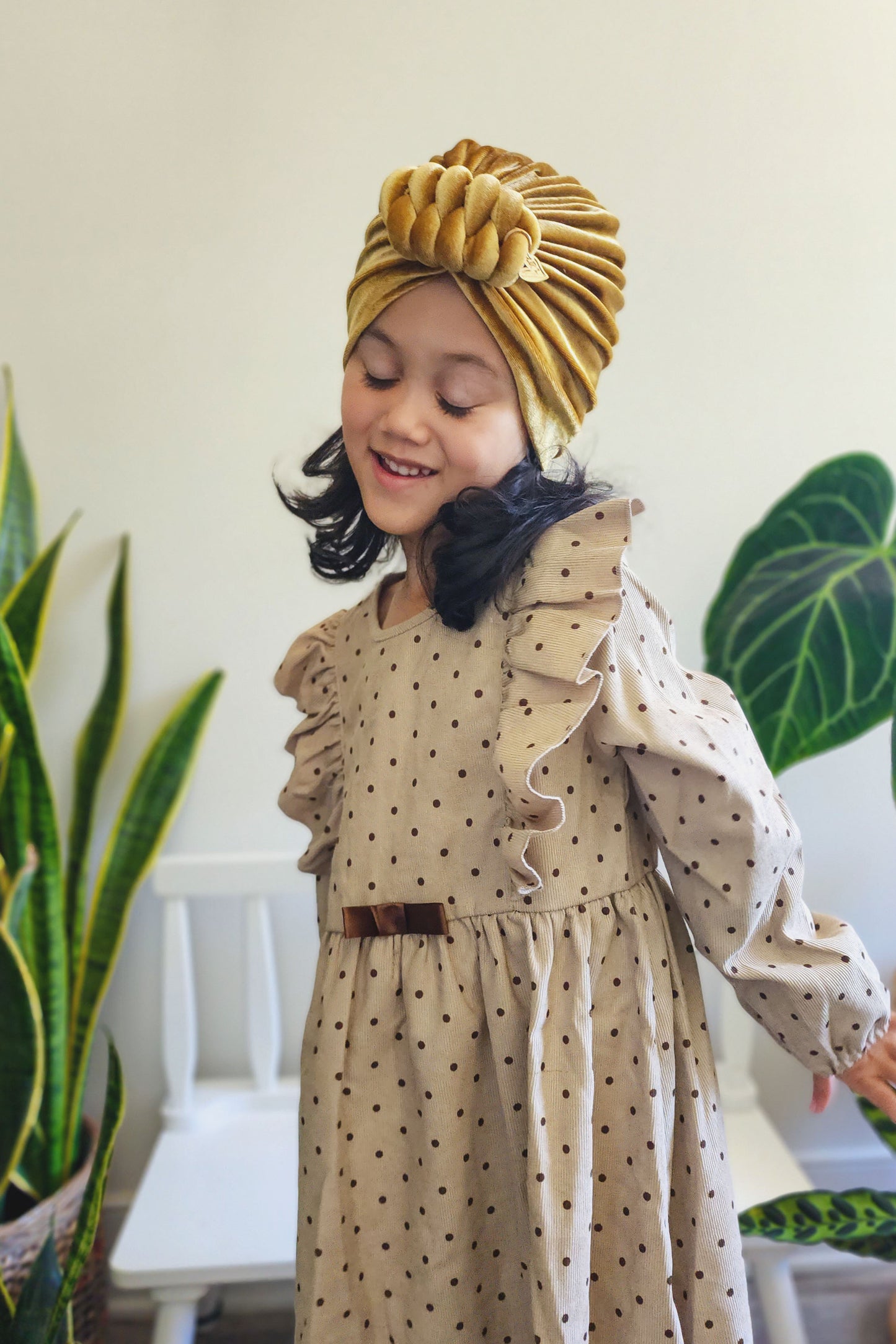 Toddler velvet turban knot in gold color close-up view