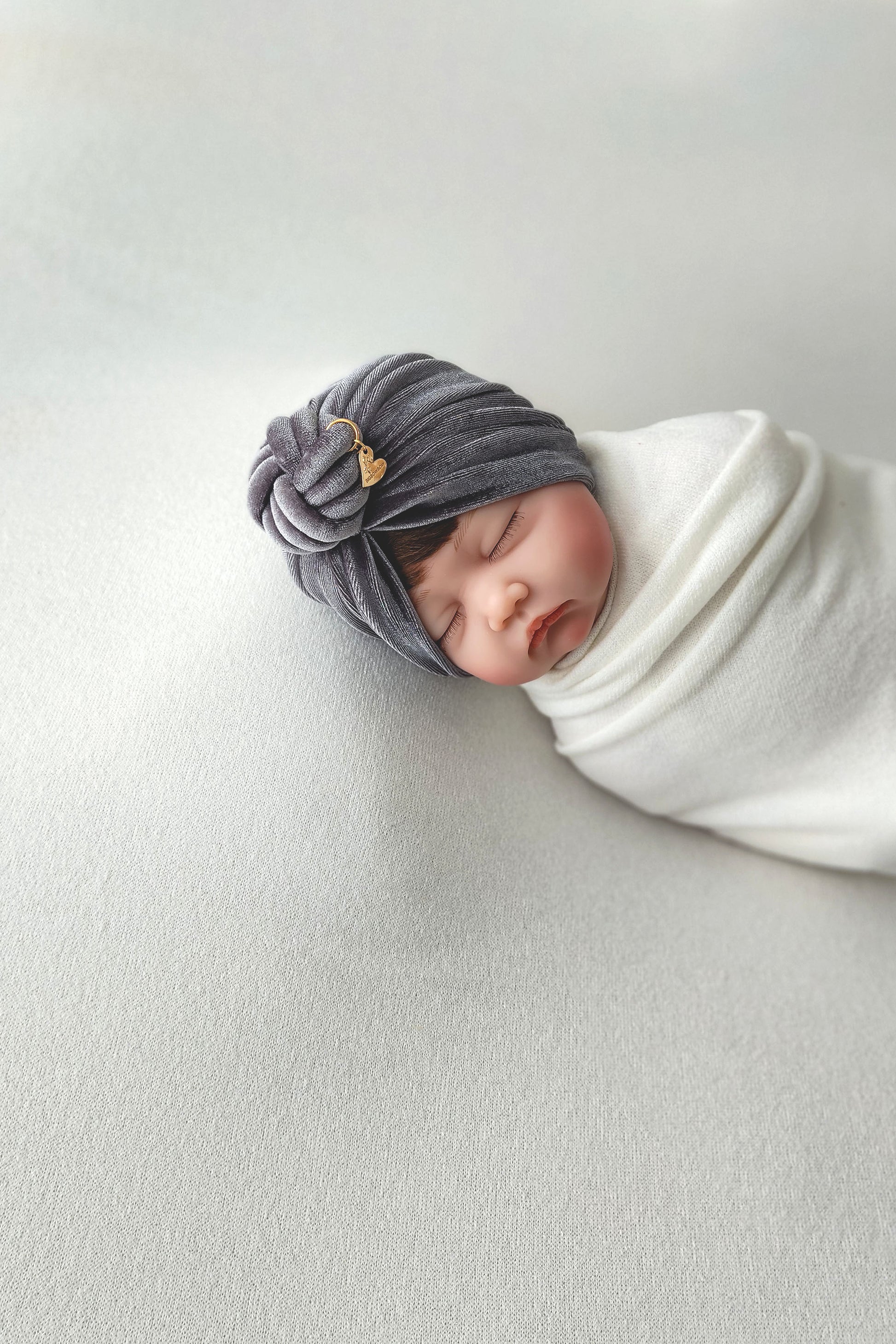 Baby girl velvet turban knot in grey color close-up view