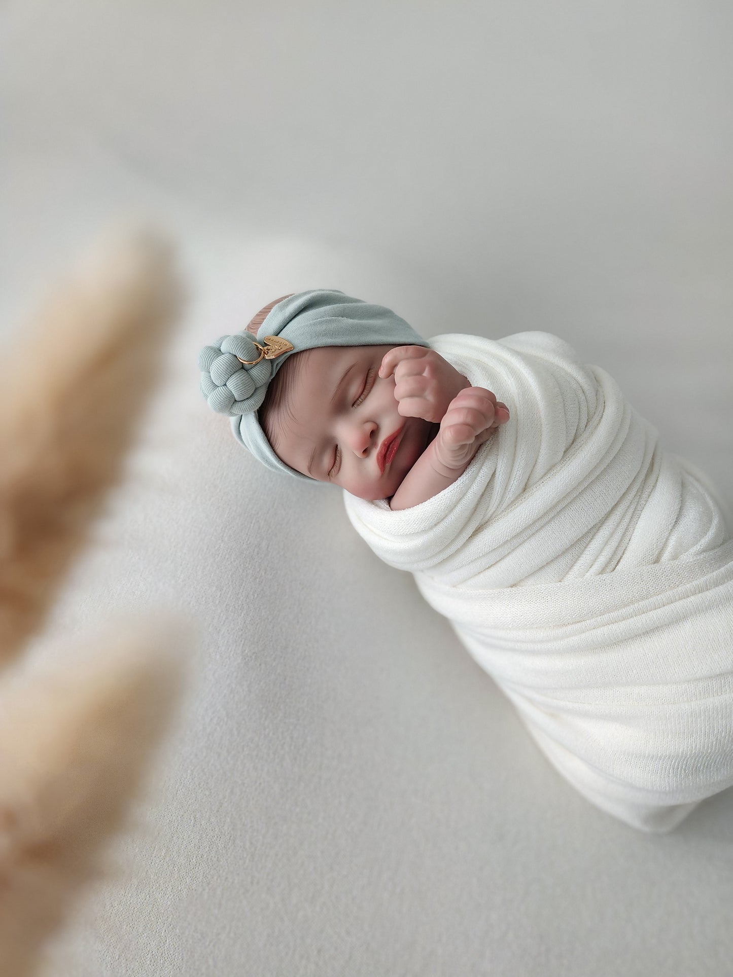 Headband knot in green mint color side view newborn size