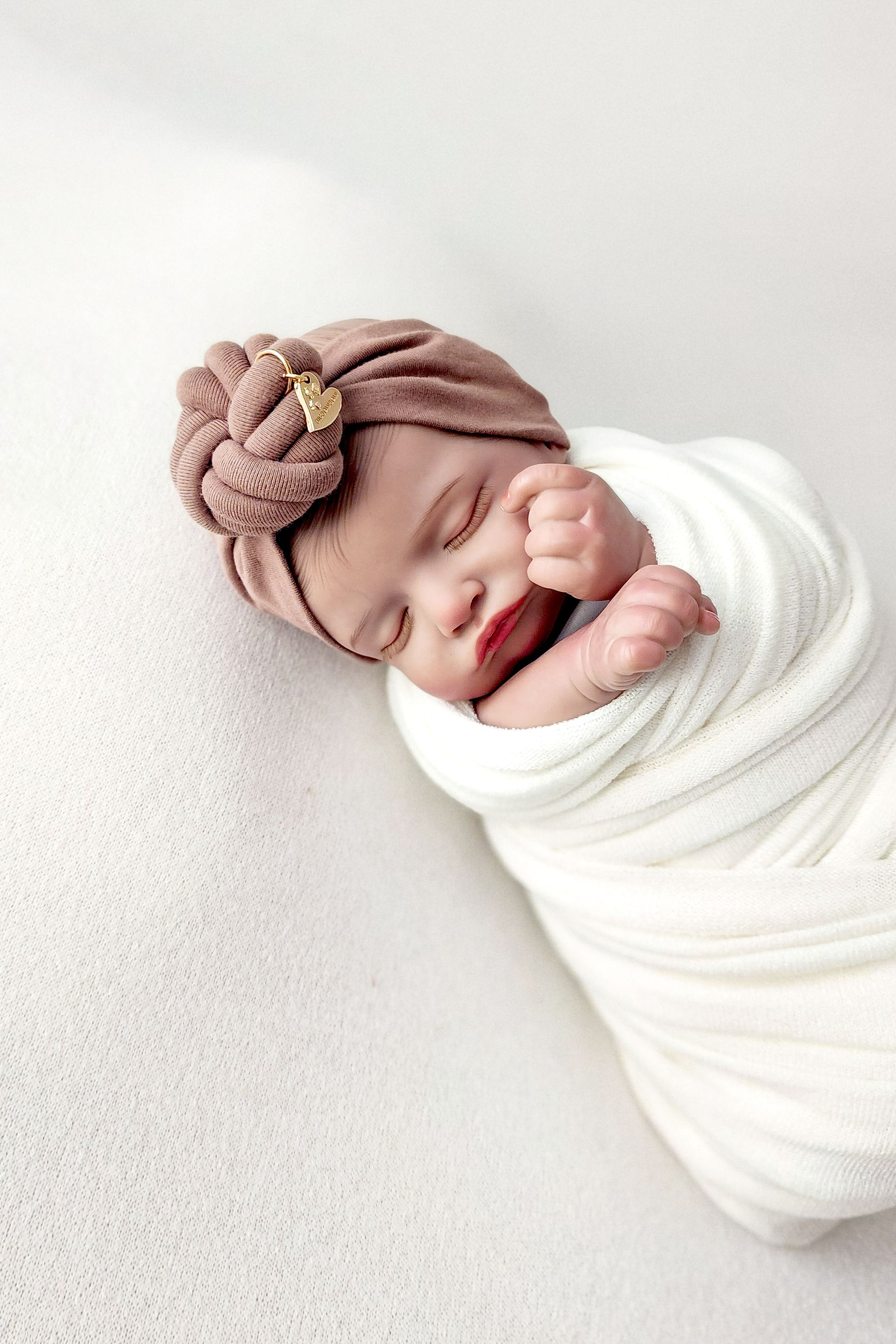 Headband knot in brown color close-up view newborn size