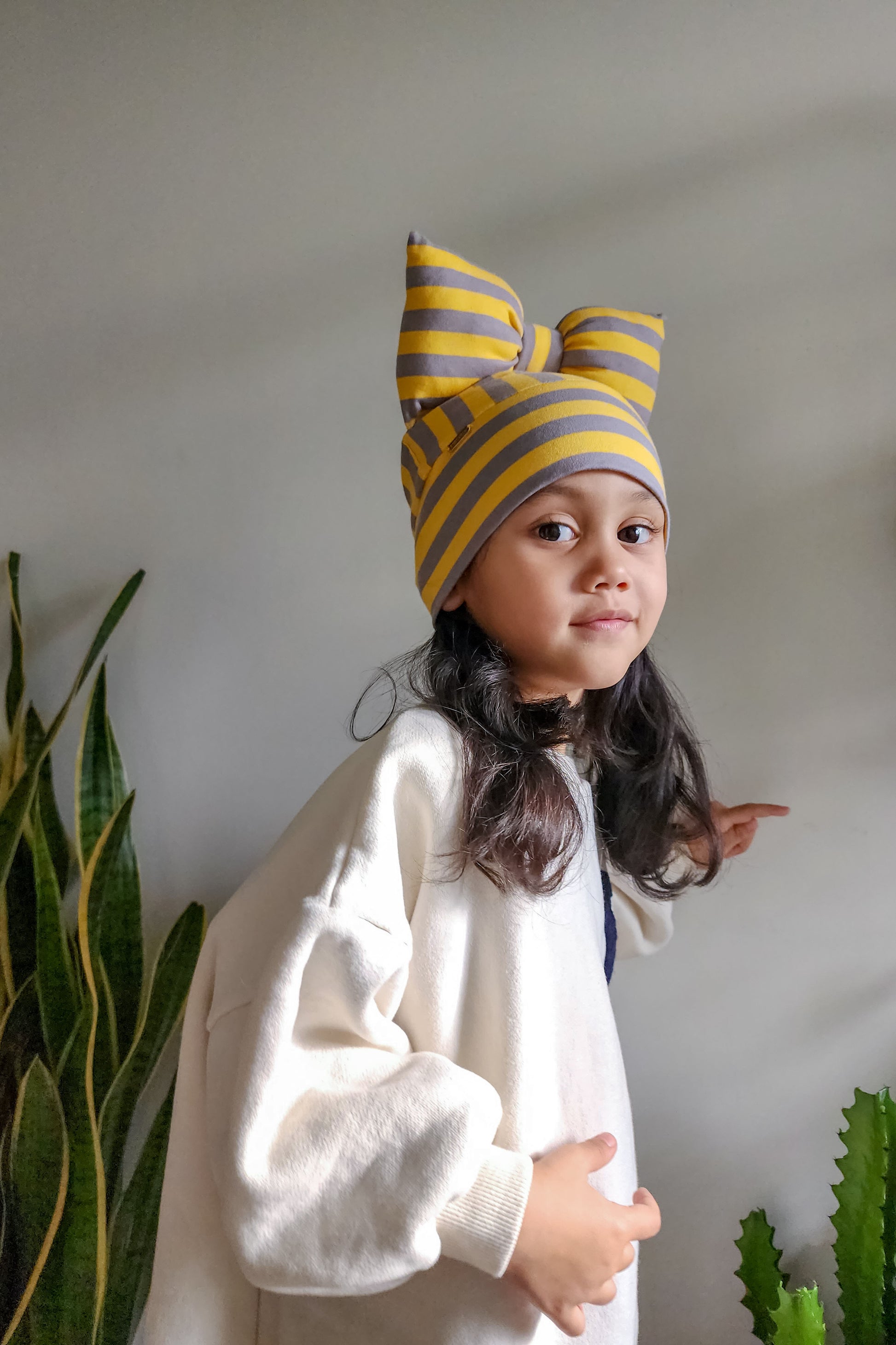 Beanie bow toddler hat stripe get side view in grey and yellow