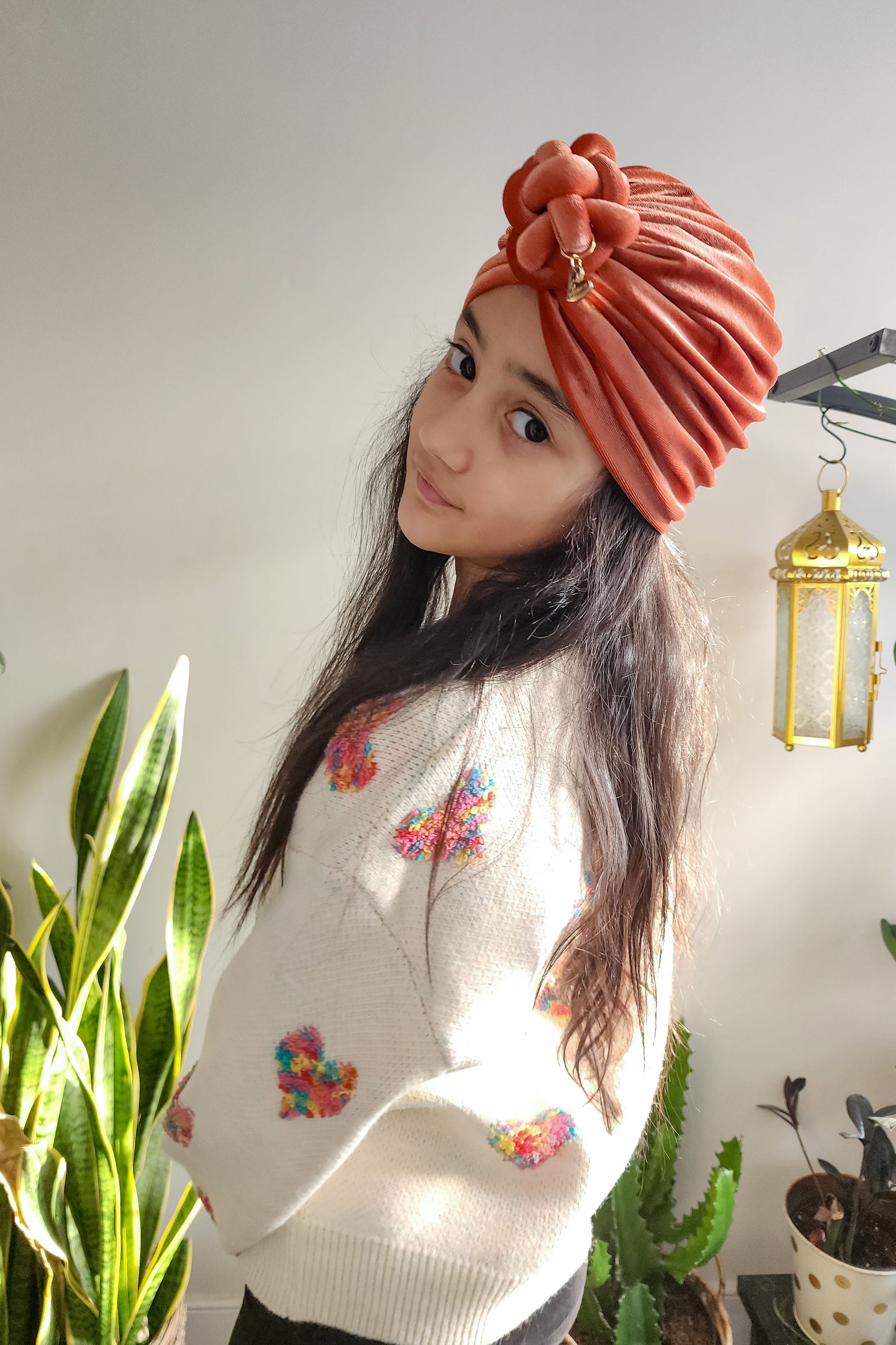 Turban velvet knot in burnt orange in side view