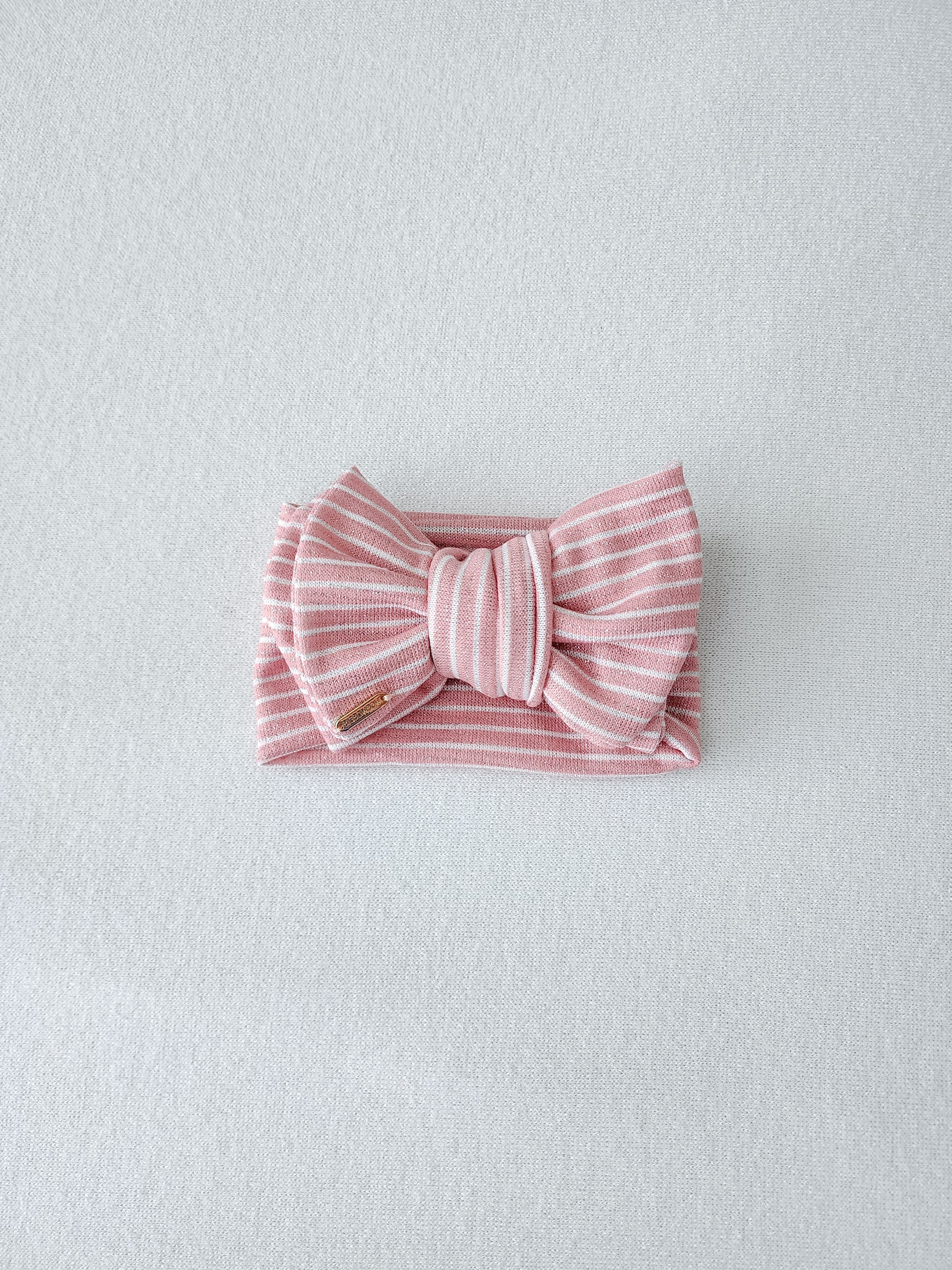 Bigbowbow oversized head wrap bow for baby and adults, glitter pink stripe. front view