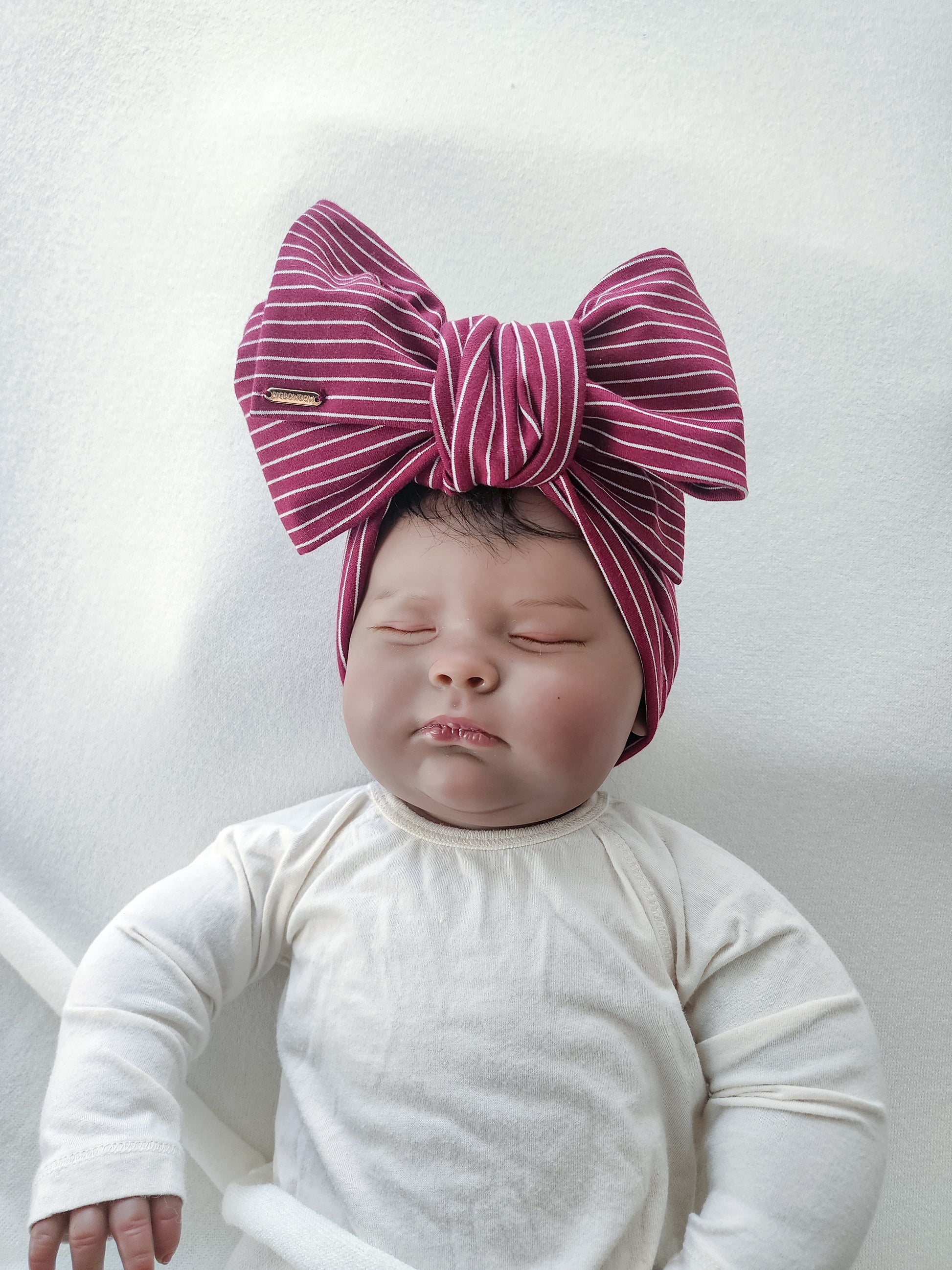 Head wrap headbands bow in small stripe white and burgundy close up view