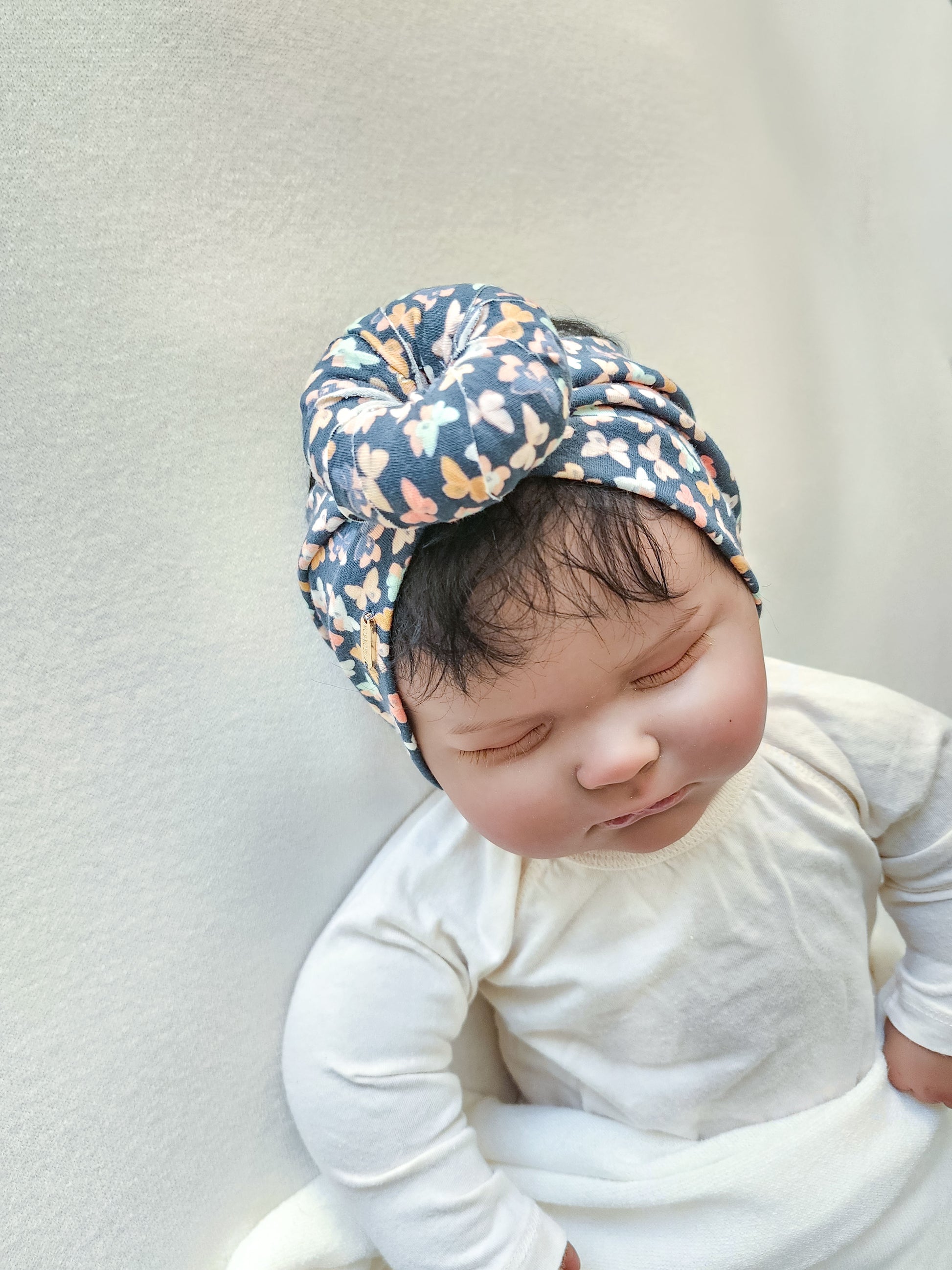 Headband donut in small butterfly print close-up view