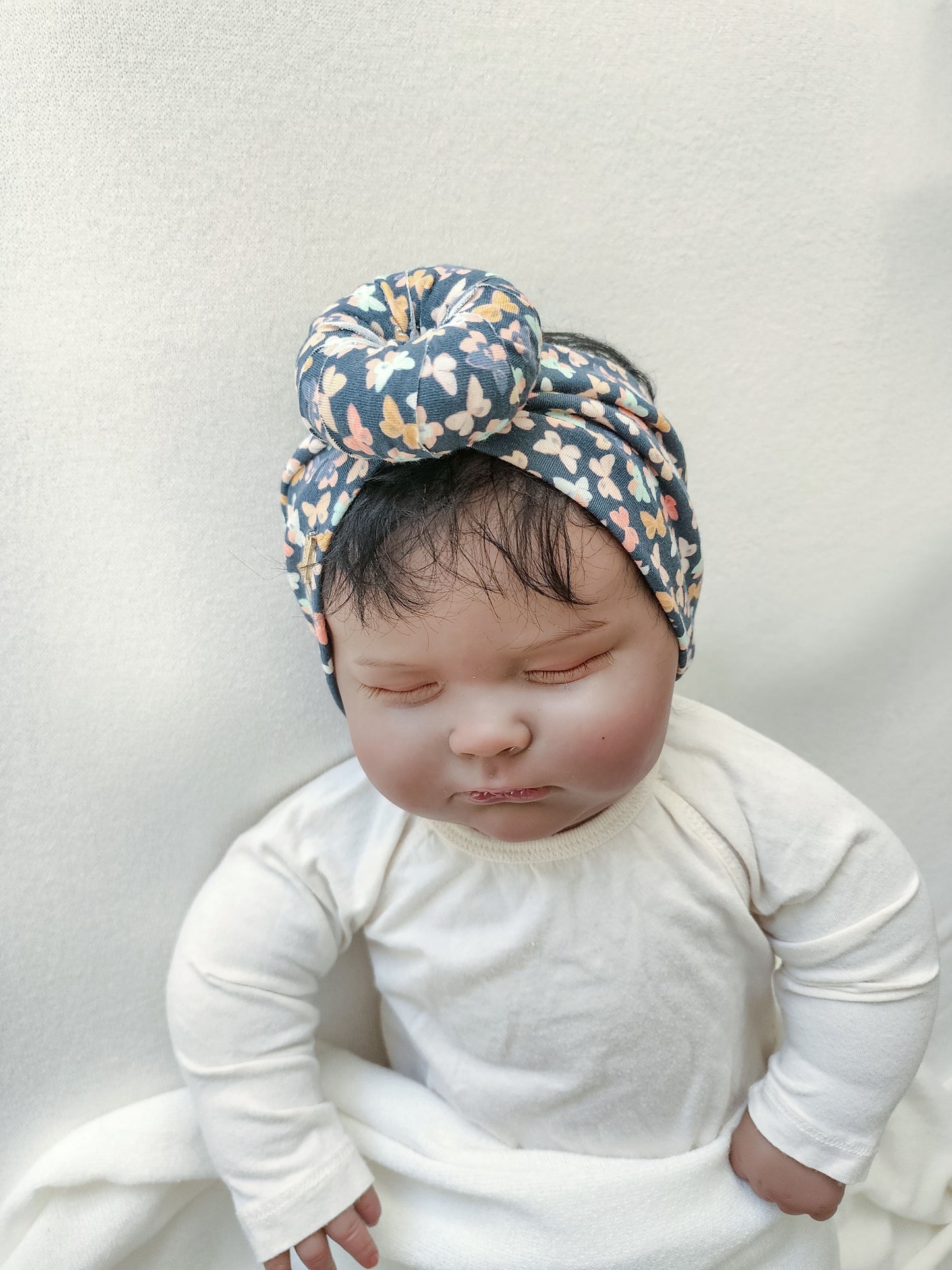 Headband donut in small butterfly print side view