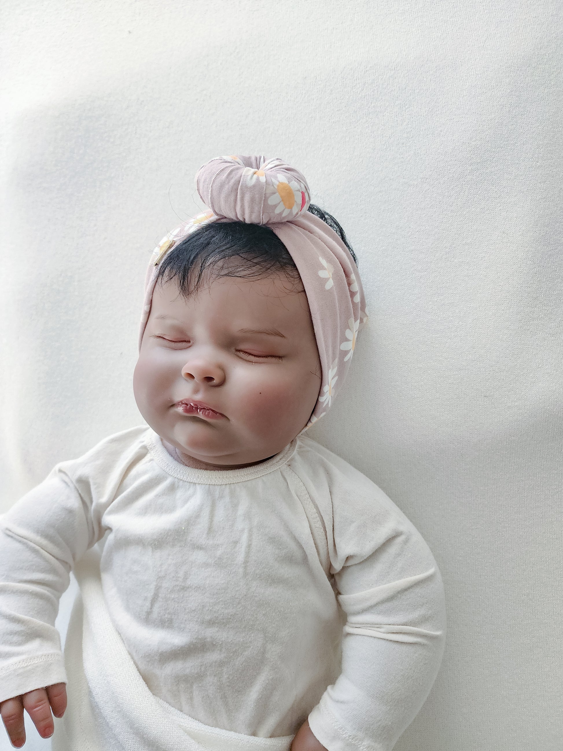 Headband donut in daisy floral print side view