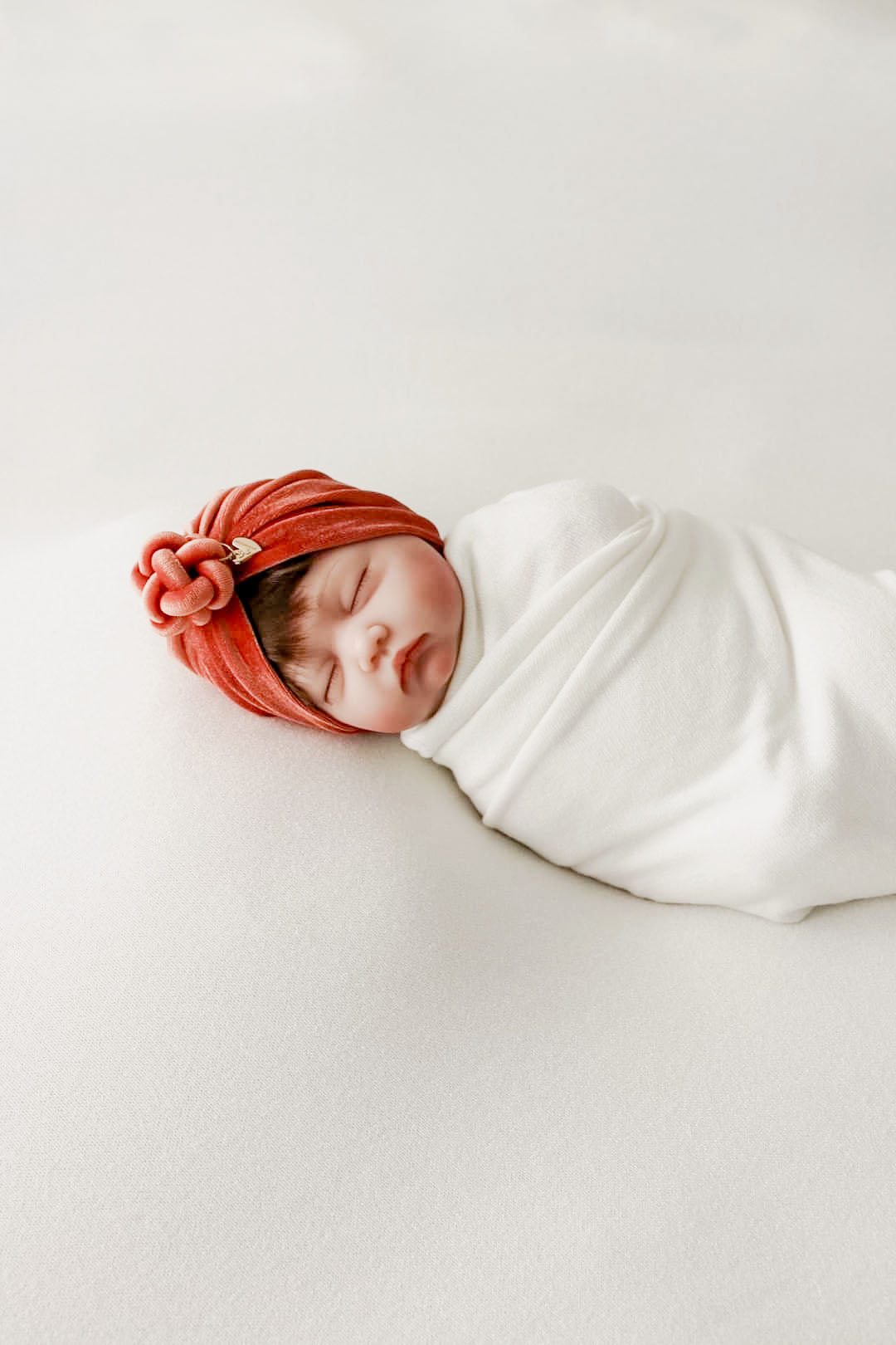 Turban velvet knot in burnt orange in details view