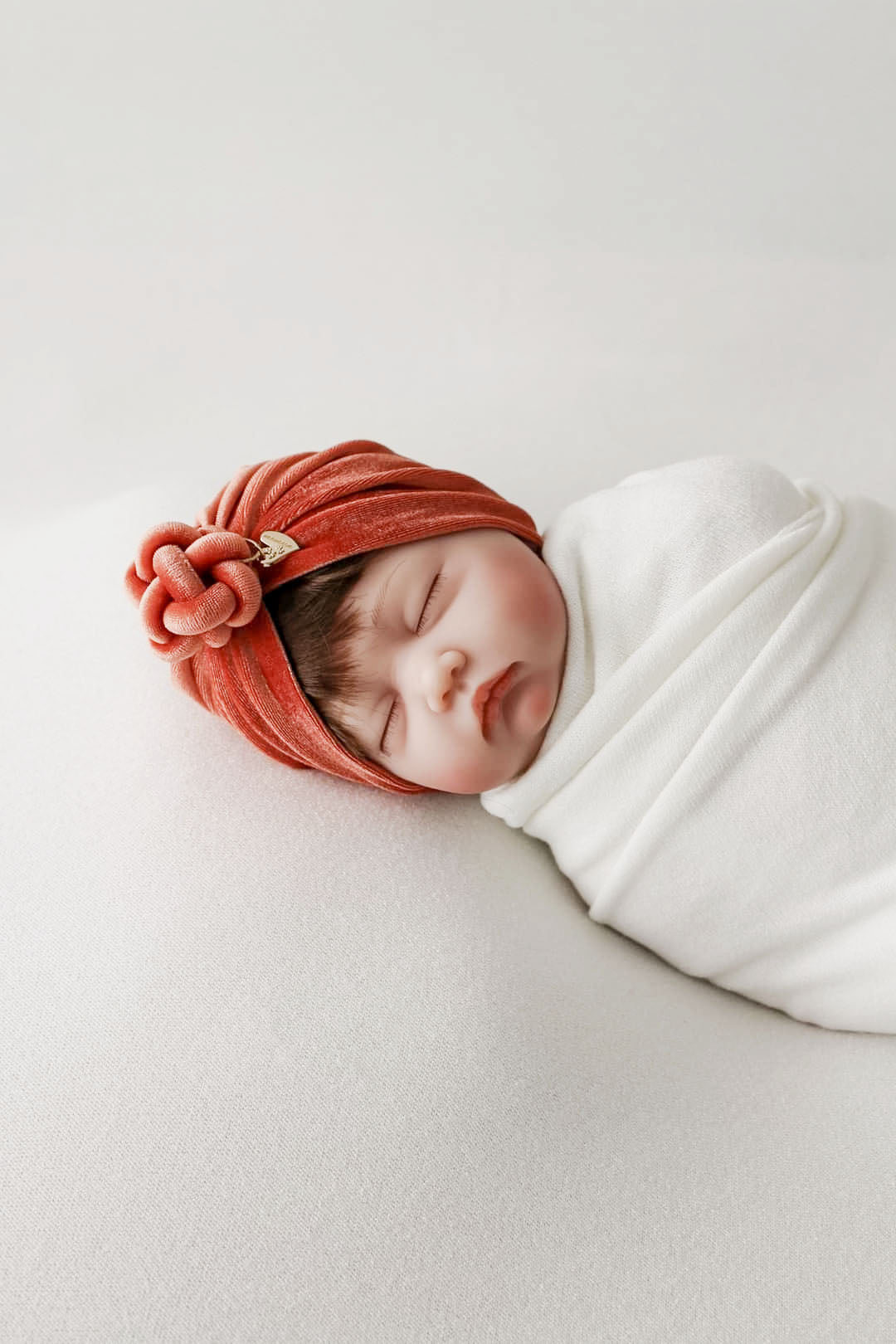 Turban velvet knot in burnt orange  side view