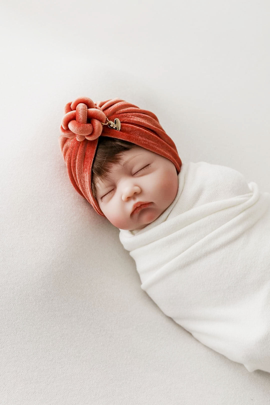 Turban velvet knot in burnt orange in details view