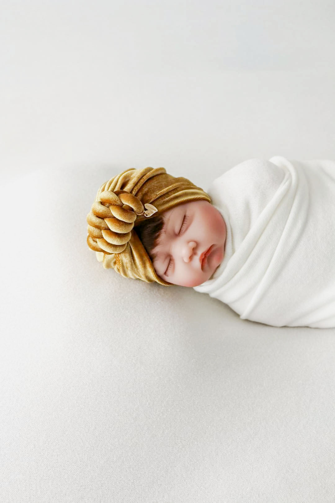 Baby girl velvet turban knot in gold color front view