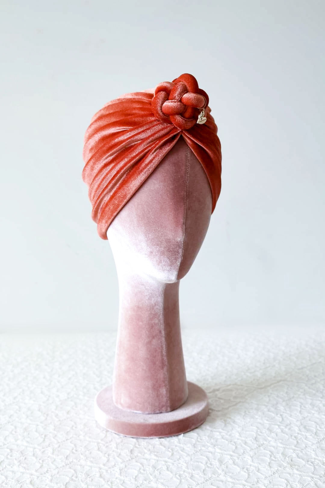 Velvet turban in burnt orange color side view