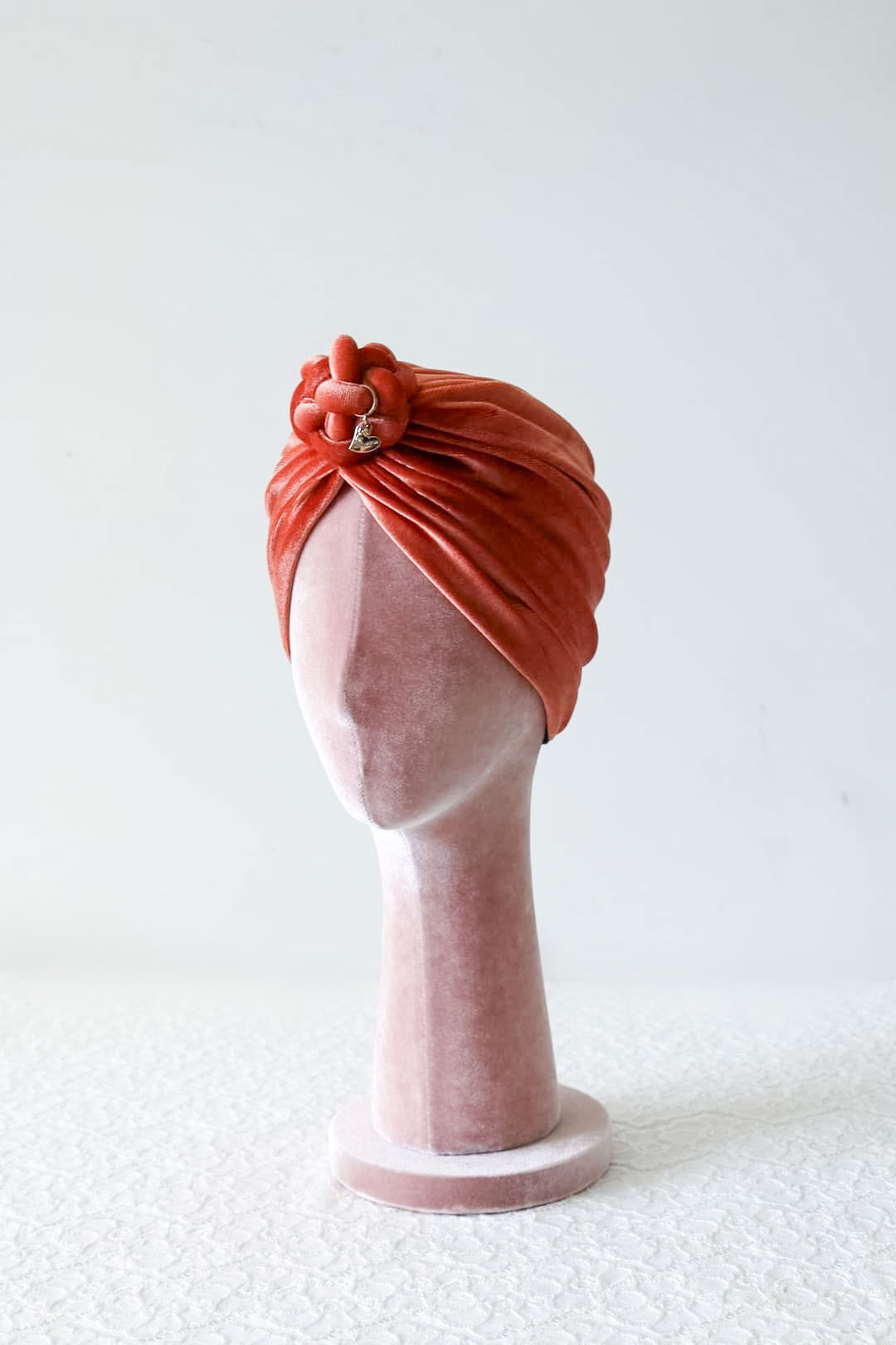 Velvet turban in burnt orange color side view