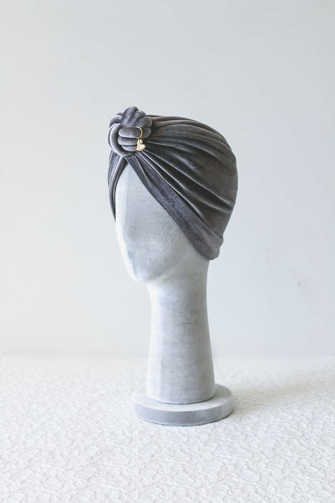 Velvet turban knot in grey color side view