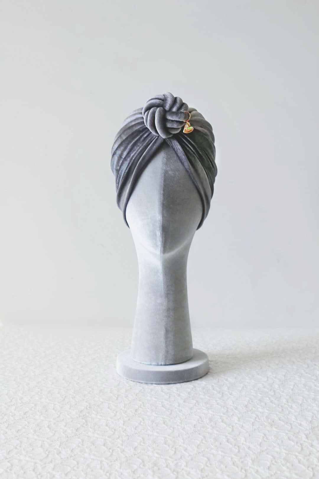 Velvet turban knot in grey color front view