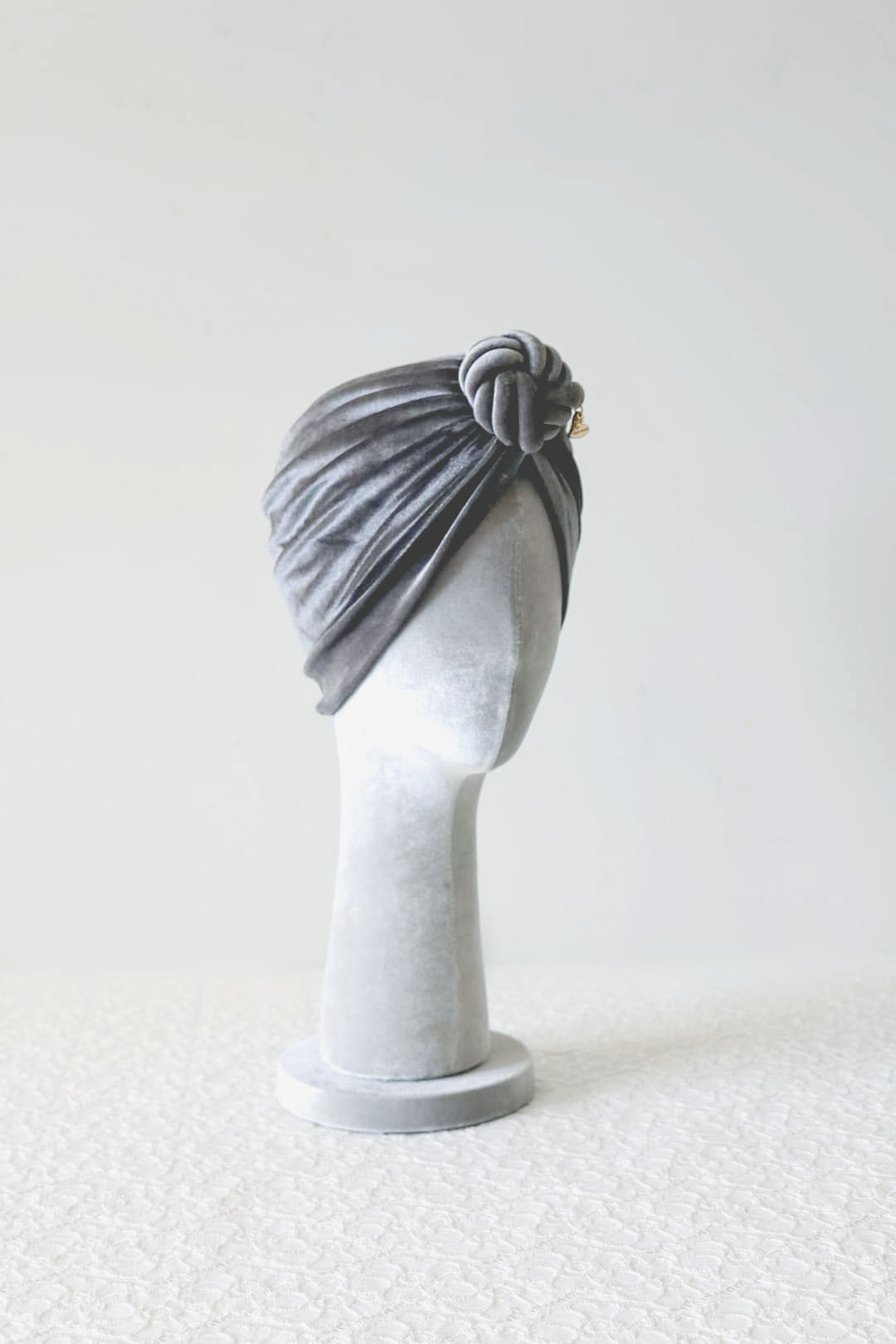 Velvet turban knot in grey color side view