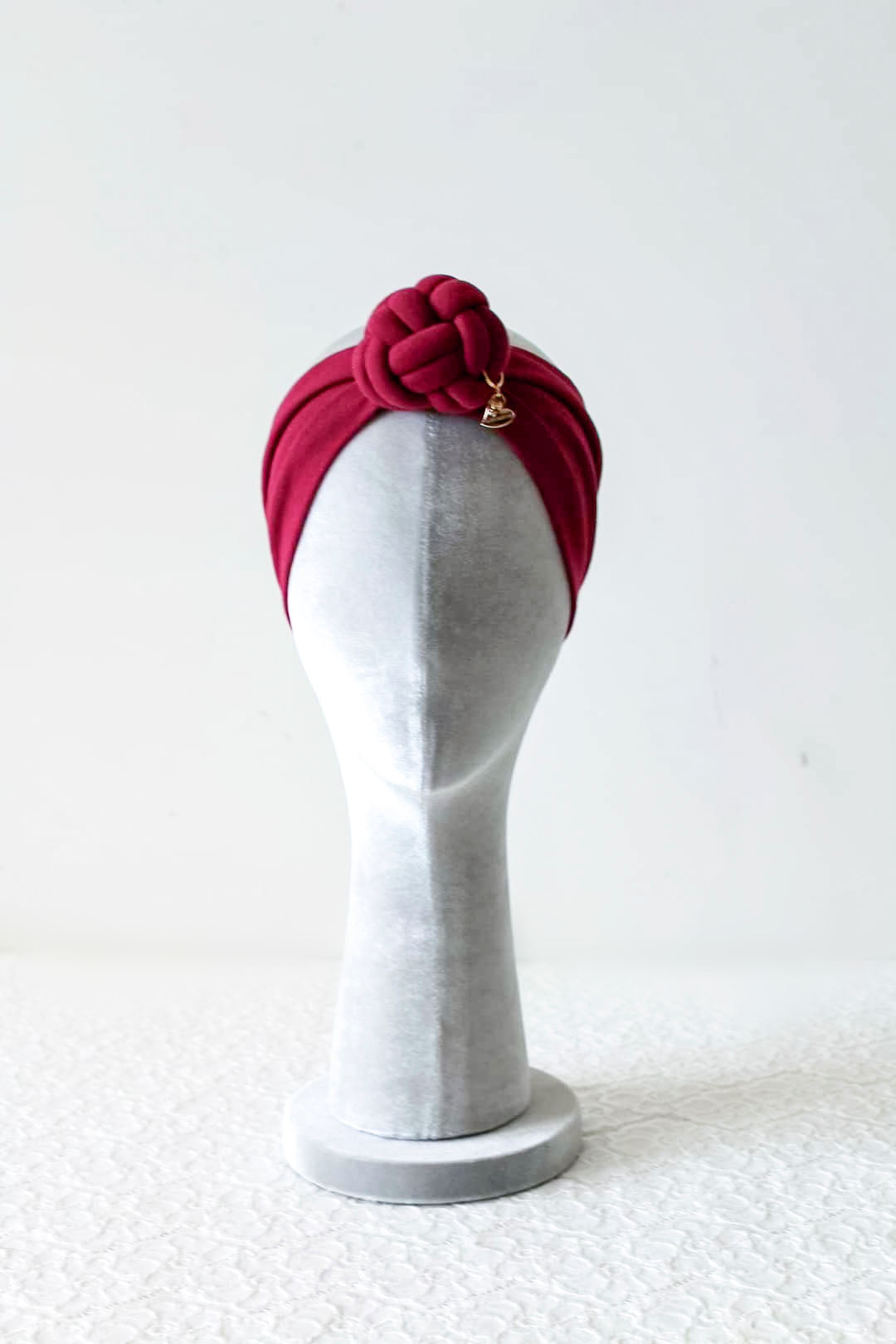 Burgundy color headbands knot front view, women size