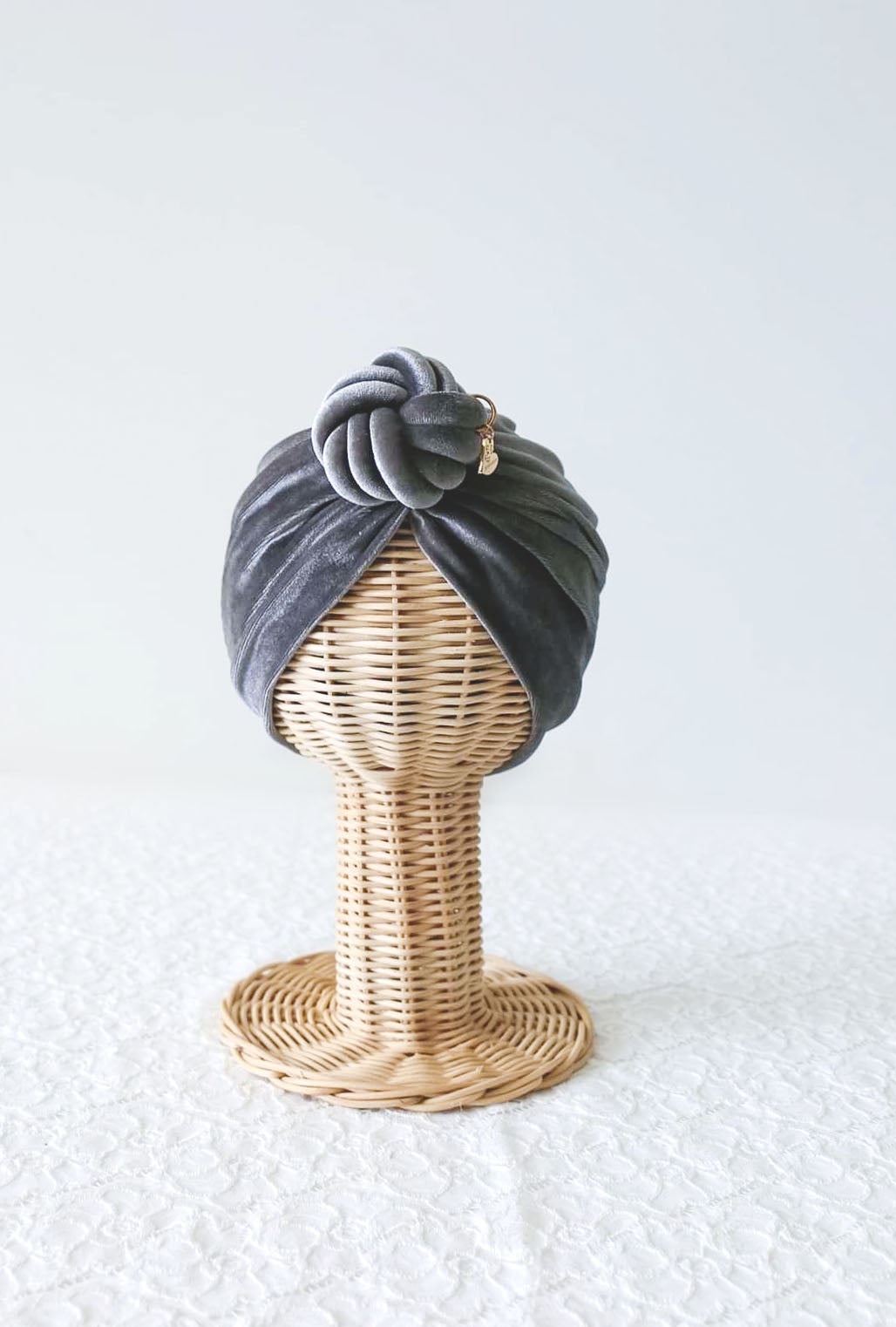 velvet turban knot in grey color close-up view