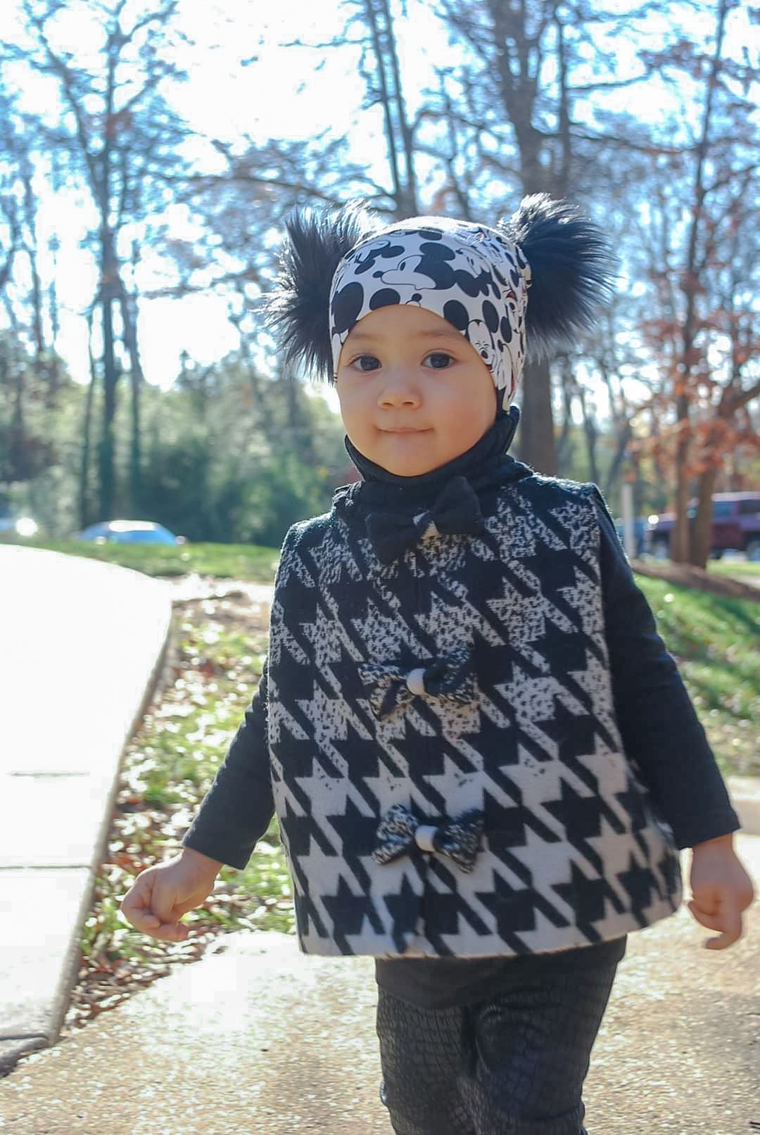 Double pompoms beanie in mickey mouse print front view 