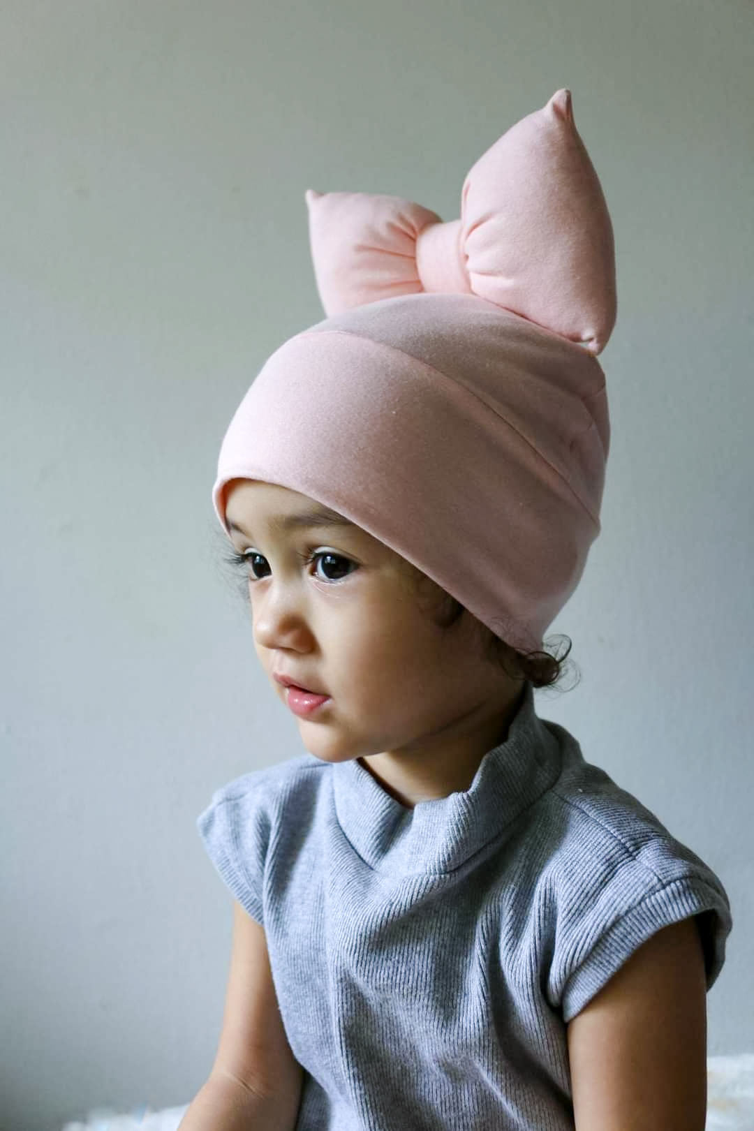 Beanie bow toddler hat soft pink side view