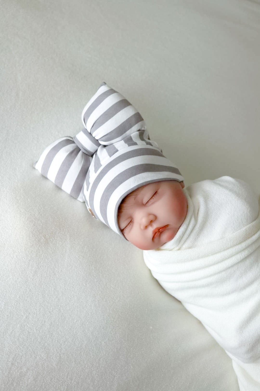 newborn beanie bow side view