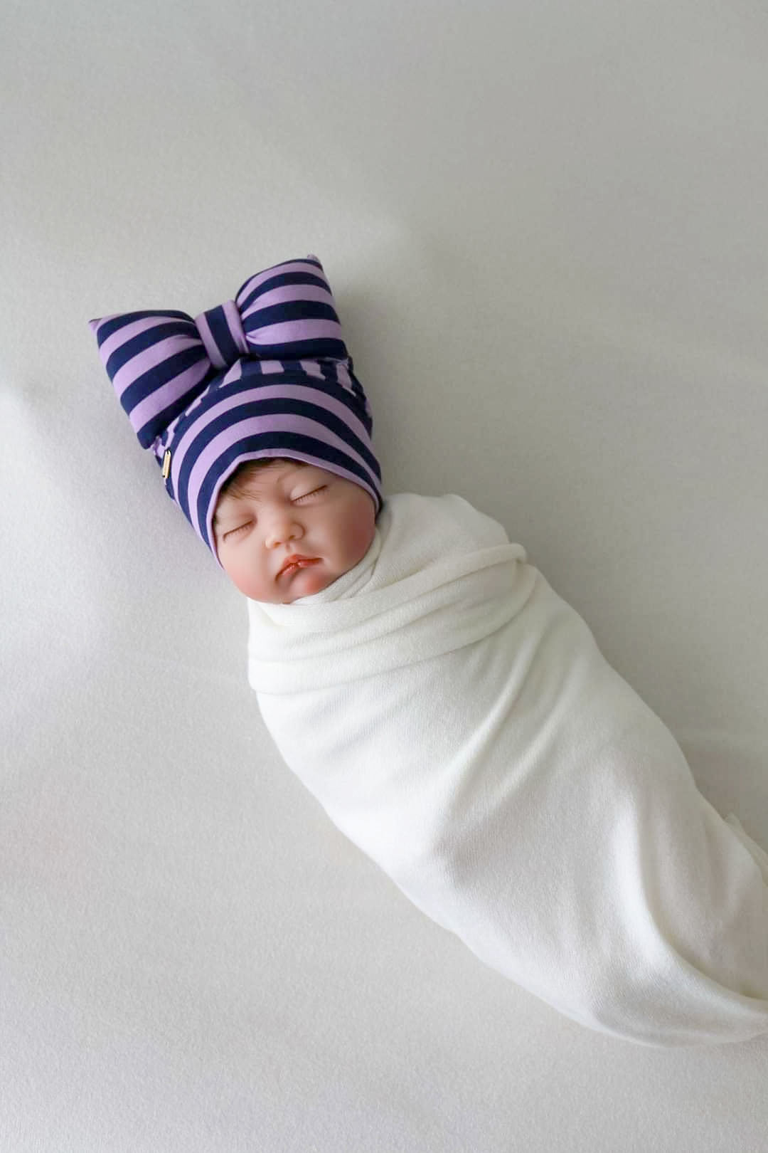 beanie bow stripe lilac and navy detail view